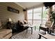 Comfortable screened porch featuring cozy seating and outdoor views at 4233 Pearson Dr, Westfield, IN 46062