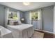 Cozy bedroom with natural light, featuring hardwood floors and neutral décor at 4350 Sylvan Rd, Indianapolis, IN 46228