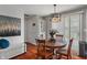 Dining room with wood table and seating, and decorative lighting at 4350 Sylvan Rd, Indianapolis, IN 46228