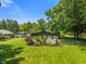 Charming home featuring a well-manicured lawn and beautifully landscaped flowerbeds at 4350 Sylvan Rd, Indianapolis, IN 46228