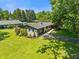 Well maintained home with a long drive, beautiful landscaping and mature trees at 4350 Sylvan Rd, Indianapolis, IN 46228