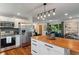 Bright, updated kitchen featuring stainless steel appliances, white cabinets, and wood countertop island at 4350 Sylvan Rd, Indianapolis, IN 46228