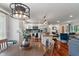 Open kitchen with white cabinets, stainless steel appliances, and wood flooring and island at 4350 Sylvan Rd, Indianapolis, IN 46228