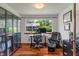 Bright home office with large window, built-in shelving, and wood floors at 4350 Sylvan Rd, Indianapolis, IN 46228