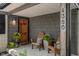 Welcoming front porch with chairs, plants, and house number displayed at 4350 Sylvan Rd, Indianapolis, IN 46228