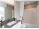 This bright bathroom features a shower and tub combination with a white vanity at 4358 Persian St, Greenwood, IN 46143