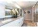 This modern bathroom has a double vanity, large mirror and framed art on the wall at 4358 Persian St, Greenwood, IN 46143
