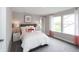 This charming bedroom is illuminated by natural light with pink accents at 4358 Persian St, Greenwood, IN 46143
