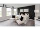 This stylish bedroom features white upholstered chairs and a graphic polka dot accent wall at 4358 Persian St, Greenwood, IN 46143