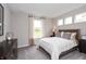 Neutral bedroom featuring a queen bed, carpet, and a window with natural light at 4358 Persian St, Greenwood, IN 46143