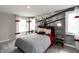 This unique bedroom has airplane art, red accents, and great natural light at 4358 Persian St, Greenwood, IN 46143