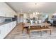 This dining room is adjacent to the kitchen with light colored counters and cabinets at 4358 Persian St, Greenwood, IN 46143