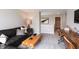 Living room with a couch, desk and chair, and dark wood floors at 4358 Persian St, Greenwood, IN 46143