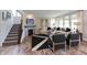 Cozy living room showcasing a fireplace, neutral decor, and a view of the staircase at 4358 Persian St, Greenwood, IN 46143