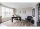 Bright home office featuring a large window, neutral decor, and stylish furnishings at 4358 Persian St, Greenwood, IN 46143