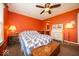 Bright bedroom with a colorful quilt, wood accents, and plenty of natural light at 4420 Victory Blvd, Indianapolis, IN 46203