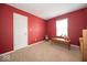 Bedroom with wood floors, neutral-toned walls, and a large window for natural light at 4420 Victory Blvd, Indianapolis, IN 46203