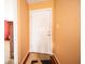 The foyer features warm paint, hardwood floors, and a view into the living room at 4420 Victory Blvd, Indianapolis, IN 46203