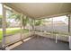 Relaxing screened porch with comfortable seating and views of the backyard at 4420 Victory Blvd, Indianapolis, IN 46203