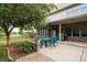 Spacious back patio with dining table and lush landscaping at 47 Torrey Pine Dr, Brownsburg, IN 46112