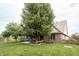 Large backyard with mature trees, a patio, and plenty of green space at 47 Torrey Pine Dr, Brownsburg, IN 46112