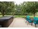 Beautiful backyard featuring a hot tub, outdoor dining area, and basketball hoop at 47 Torrey Pine Dr, Brownsburg, IN 46112