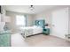 Bedroom with aqua accents, neutral carpet and lots of light at 47 Torrey Pine Dr, Brownsburg, IN 46112