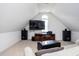 Finished bonus room with high ceilings, a TV, speakers, and a window at 47 Torrey Pine Dr, Brownsburg, IN 46112