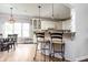 Open kitchen design featuring a bar with stool seating and adjacent breakfast nook at 47 Torrey Pine Dr, Brownsburg, IN 46112