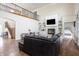 Bright living room with vaulted ceilings, fireplace, built-ins, and staircase for architectural appeal at 47 Torrey Pine Dr, Brownsburg, IN 46112