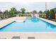 Beautiful community pool with a spacious pool deck, seating, and a pool house, ideal for summer relaxation at 47 Torrey Pine Dr, Brownsburg, IN 46112
