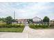 Community pool area with a gated entrance, lush landscaping, and a view of the pool and surrounding neighborhood at 47 Torrey Pine Dr, Brownsburg, IN 46112
