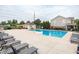 Community pool featuring lounge chairs, a shaded area, and ample space for relaxation and recreation at 47 Torrey Pine Dr, Brownsburg, IN 46112