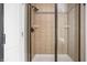 Shower stall with black hardware, tile and clear glass door at 47 Torrey Pine Dr, Brownsburg, IN 46112