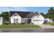 Charming one-story home showcasing a well-manicured lawn and attached two car garage at 5084 Foxley Park Ln, Avon, IN 46123