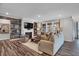 Spacious living room with ample seating, fireplace, and a decorative accent wall at 5084 Foxley Park Ln, Avon, IN 46123