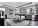 Luxury bedroom featuring a four-poster bed, tray ceiling, and soft, neutral color palette at 5084 Foxley Park Ln, Avon, IN 46123