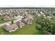 Expansive aerial view showcasing a well-planned neighborhood with lush green spaces and tree coverage at 5194 Orahood Ct, Plainfield, IN 46168
