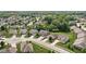 Overhead shot capturing a residential neighborhood featuring manicured lawns and tree-lined streets at 5194 Orahood Ct, Plainfield, IN 46168