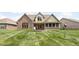 Expansive backyard with manicured lawn and brick patio, ideal for outdoor entertaining at 5194 Orahood Ct, Plainfield, IN 46168