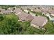 Aerial view showcasing a home's well-maintained lawn, screened-in porch, and partially fenced backyard at 5194 Orahood Ct, Plainfield, IN 46168