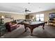 Basement featuring a billiards table, large L-shaped couch, and recessed lighting at 5194 Orahood Ct, Plainfield, IN 46168
