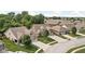 Charming brick home featuring an attached two-car garage, a well-manicured lawn, and lush trees at 5194 Orahood Ct, Plainfield, IN 46168