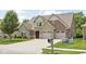 Attractive two-story home with stone and brick facade, well maintained landscaping, and attached garage at 5194 Orahood Ct, Plainfield, IN 46168