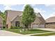 Charming two-story home with stone and brick exterior, well-manicured lawn, and a two car garage at 5194 Orahood Ct, Plainfield, IN 46168