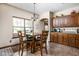 Eat-in kitchen area featuring a breakfast table, tile flooring, and dark wood cabinetry at 5194 Orahood Ct, Plainfield, IN 46168