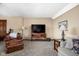 Comfortable living room features a flat screen television, accent chair, and natural light at 5194 Orahood Ct, Plainfield, IN 46168