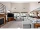 Spacious living room featuring a fireplace, plush seating, and abundant natural light from large windows at 5194 Orahood Ct, Plainfield, IN 46168