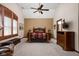Spacious main bedroom featuring a tray ceiling, large windows with shutters, and carpeted floors at 5194 Orahood Ct, Plainfield, IN 46168
