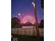 Backyard fence with a fireworks display and a wooden post in the foreground at 52 S 16Th Ave, Beech Grove, IN 46107
